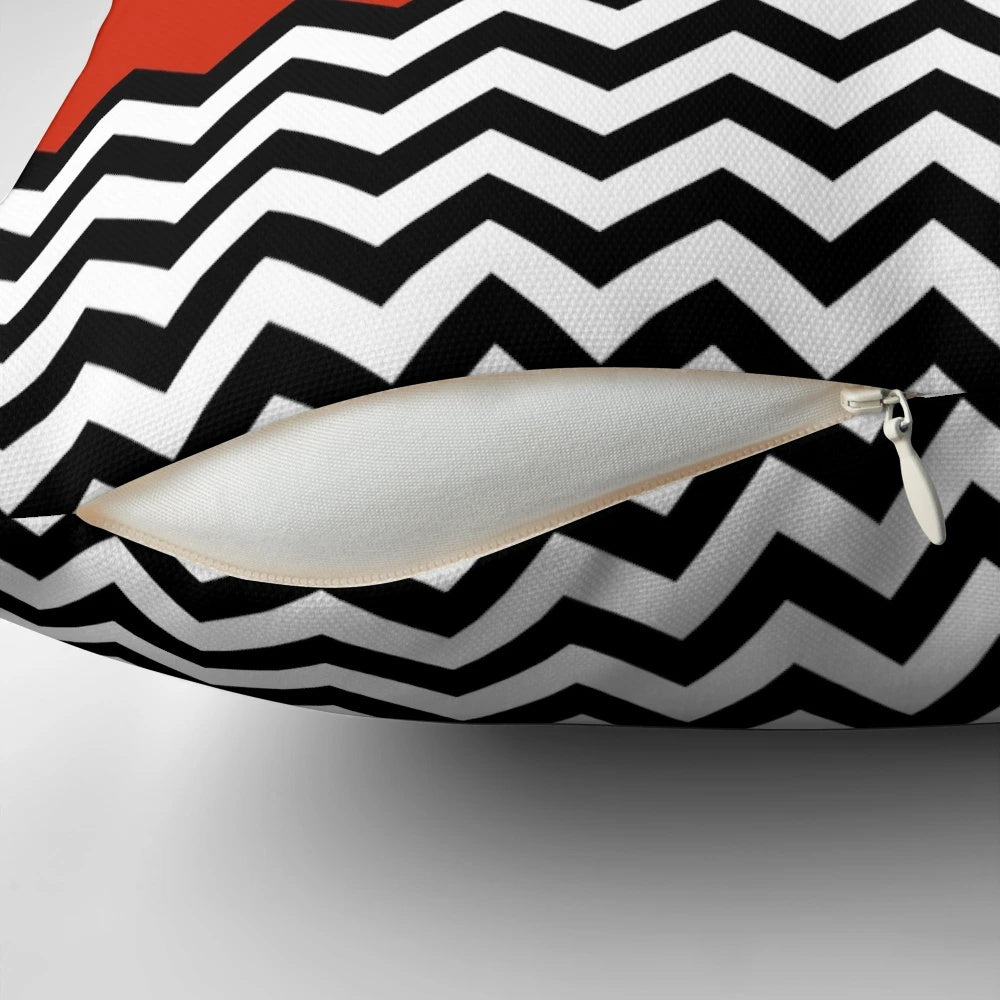 A black, white, and red graphic pillow inspired by the iconic Black Lodge from the TV series Twin Peaks.