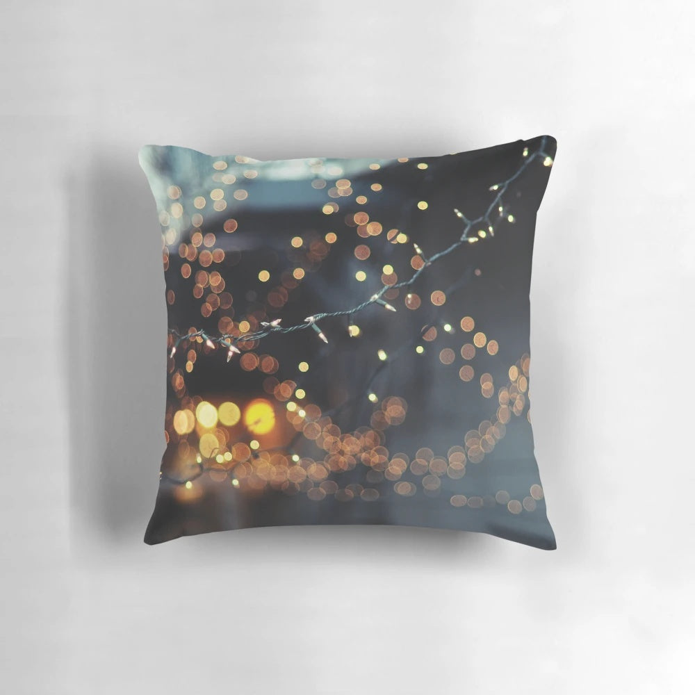 Cozy pillow with twinkling lights and bokeh effect, perfect for adding a romantic touch to any room.