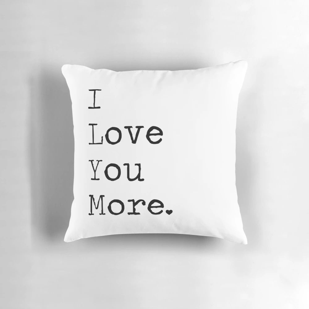 Black and white typographic "I Love You More" pillow