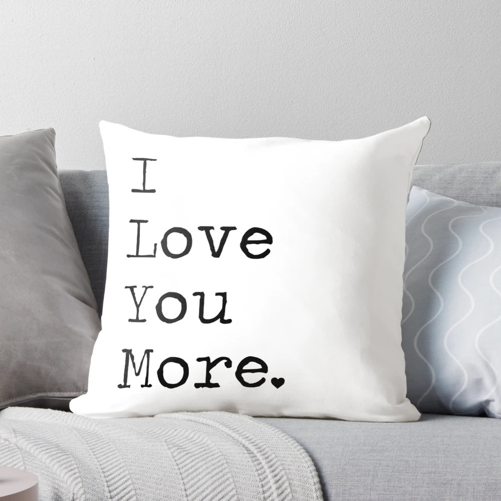 Black and white typographic "I Love You More" pillow