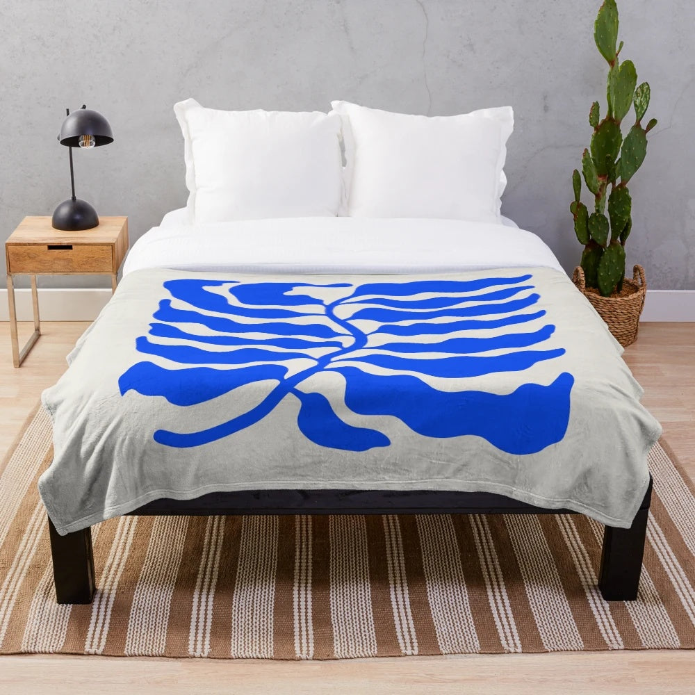 Ultramarine blue plush blanket with mid-century modern art-inspired design