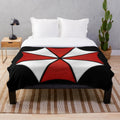 Umbrella Corporation plush blanket with red logo