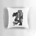 Handmade linocut print of a mermaid and diver kissing underwater on a decorative pillow