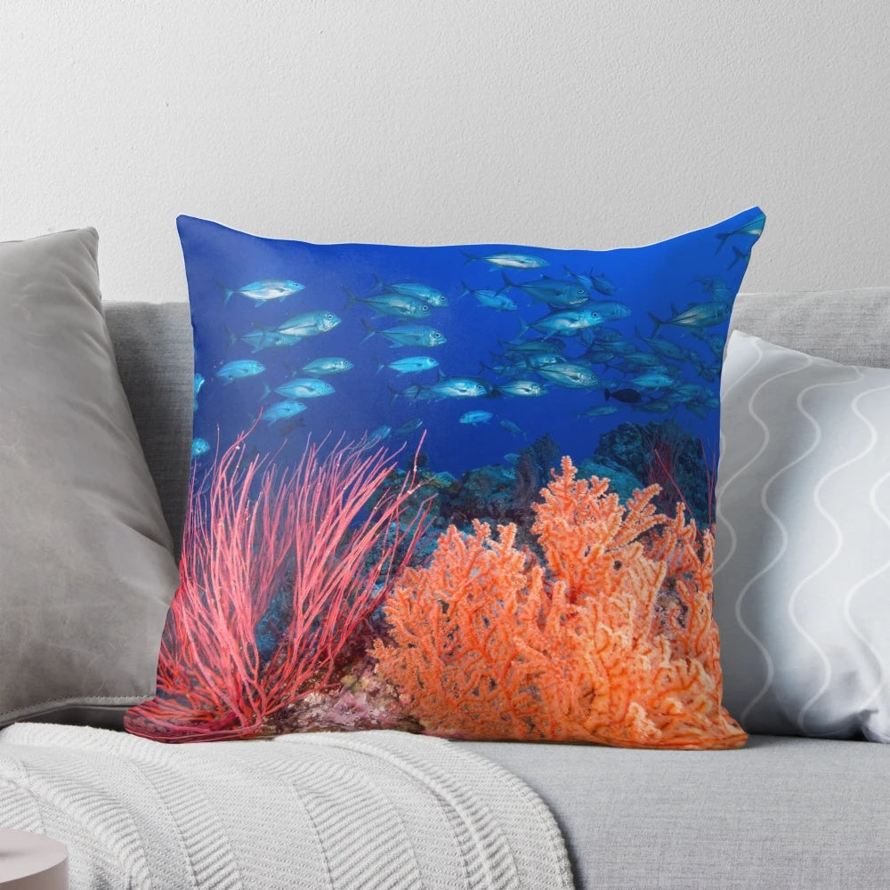Soft corals and a school of trevally fish swimming in the Great Barrier Reef, Queensland, Australia