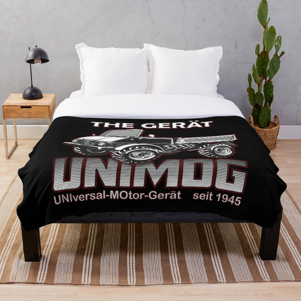 Unimog-inspired plush blanket with a retro truck graphic design