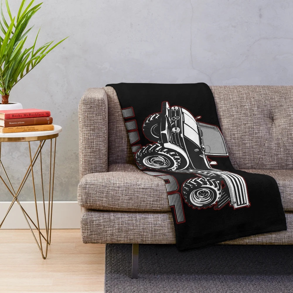 Unimog-inspired plush blanket with a retro truck graphic design