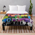 Vibrant album cover collage design printed on a soft, cozy plush blanket