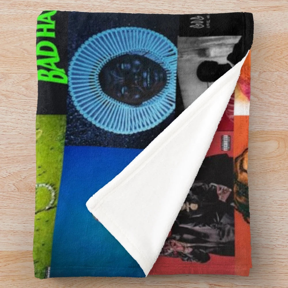 Vibrant album cover collage design printed on a soft, cozy plush blanket