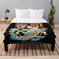 Plush blanket featuring a black and colorful anime-style monster with sushi, noodles, and waves
