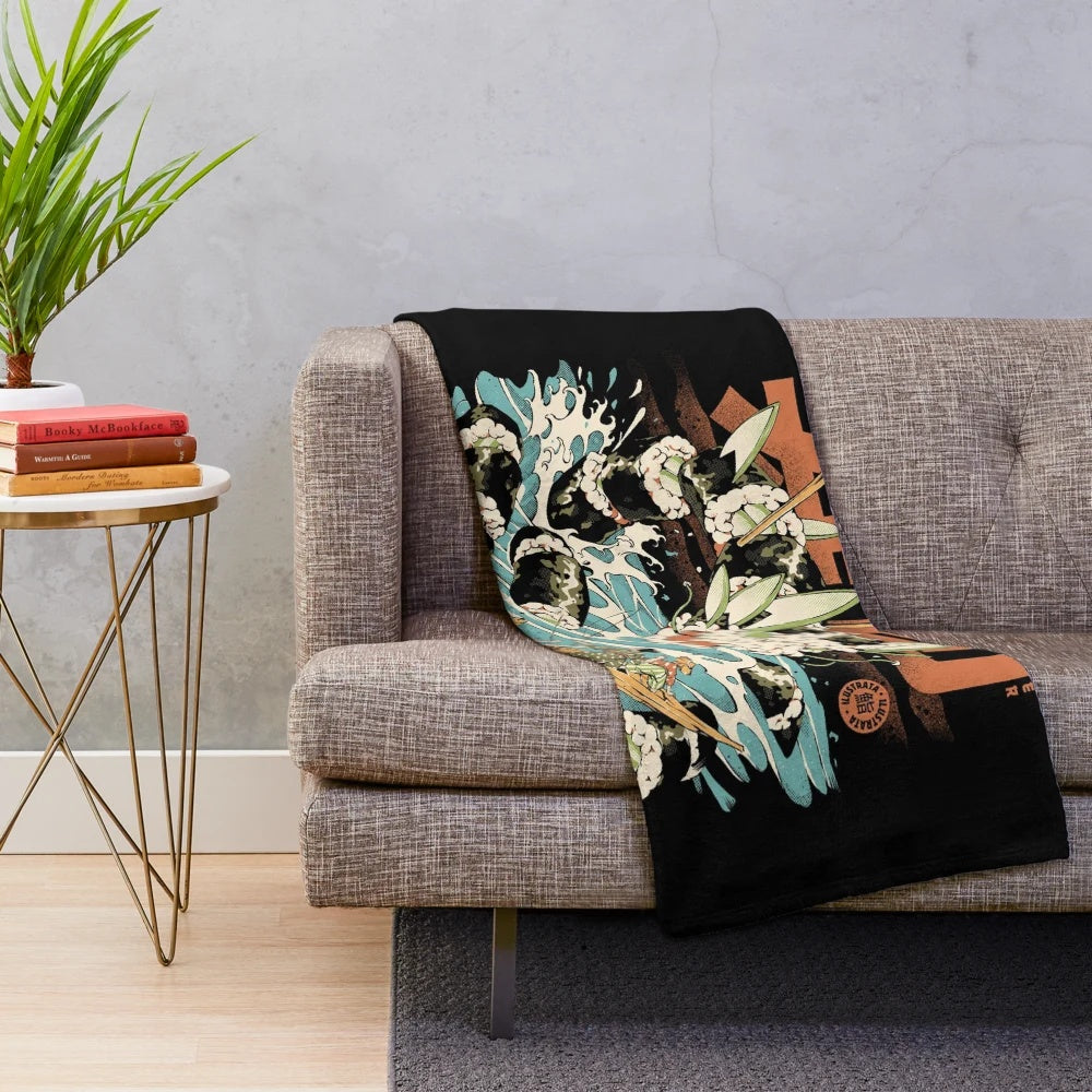 Plush blanket featuring a black and colorful anime-style monster with sushi, noodles, and waves