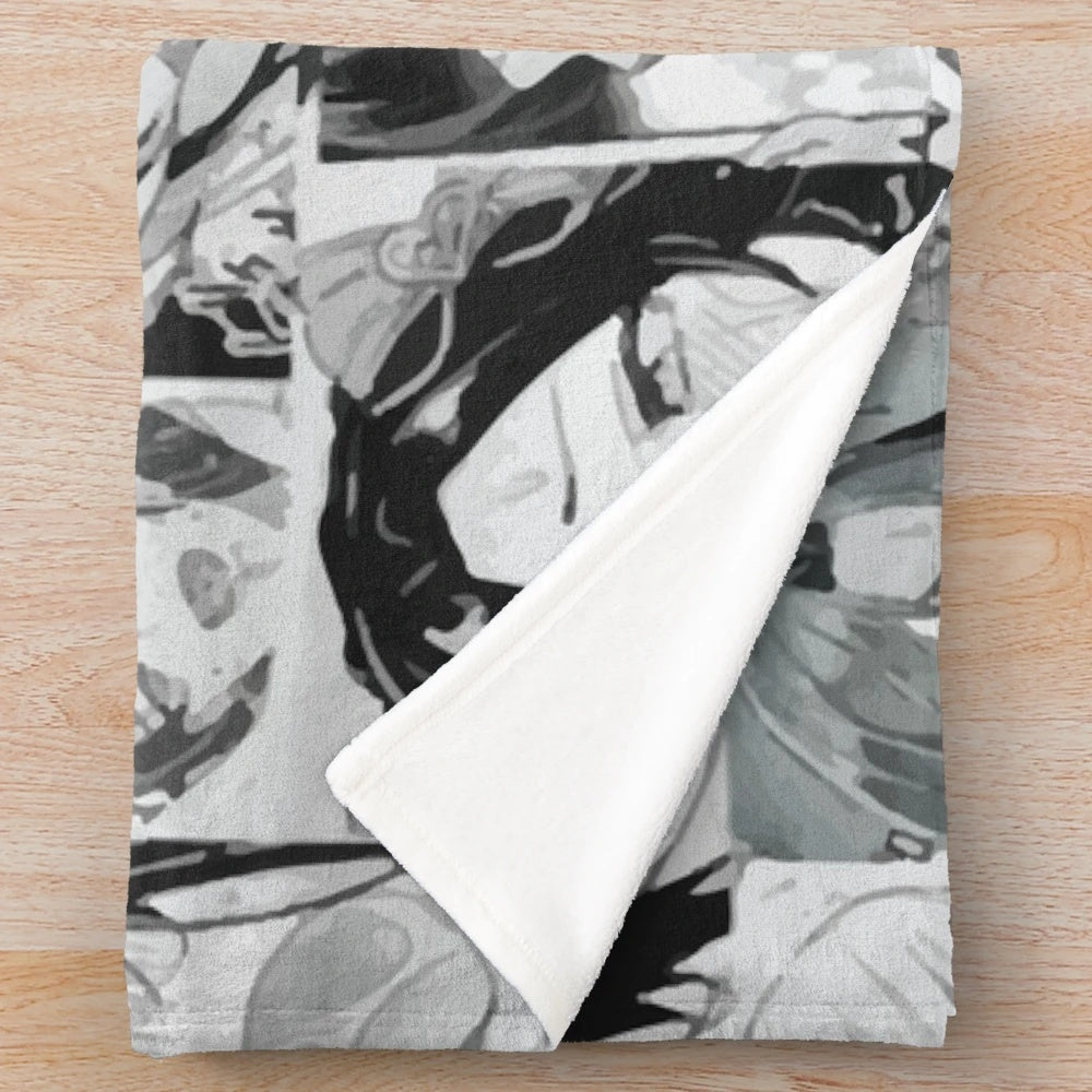 Plush blanket featuring a panel of weird, anime-style faces