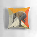 Decorative pillow featuring a graphic design of pyramids and an elephant in balance.