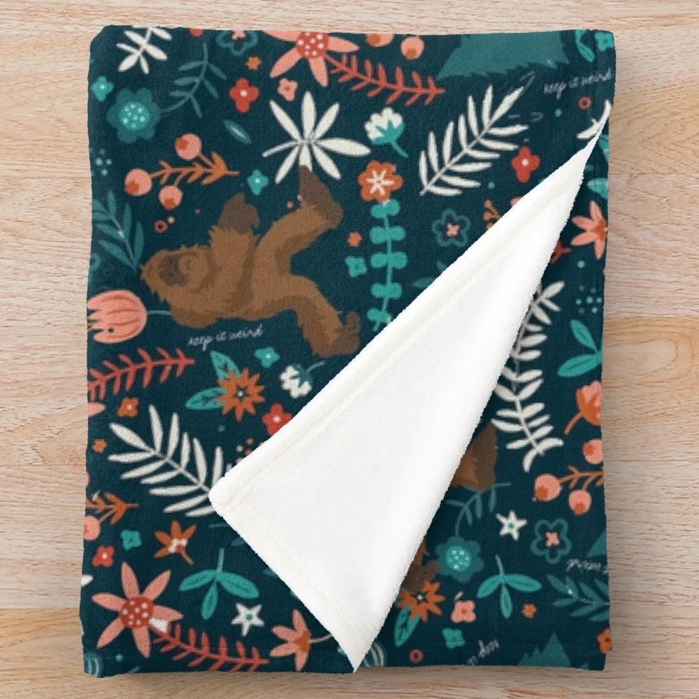 Bigfoot floral plush blanket with a unique, quirky design