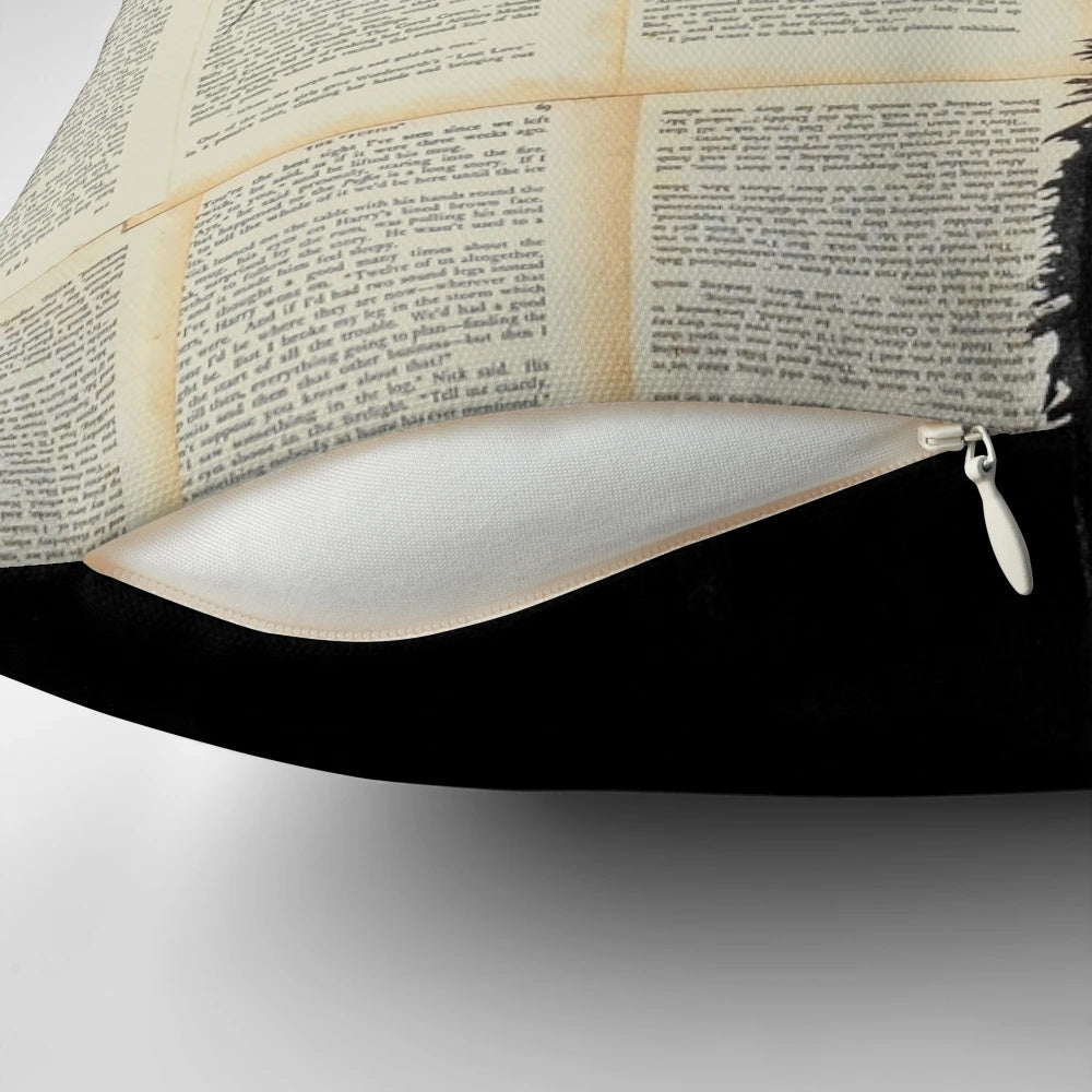 A decorative cat-themed throw pillow featuring a black and white ink drawing on book pages, inspired by the artwork of Loui Jover.