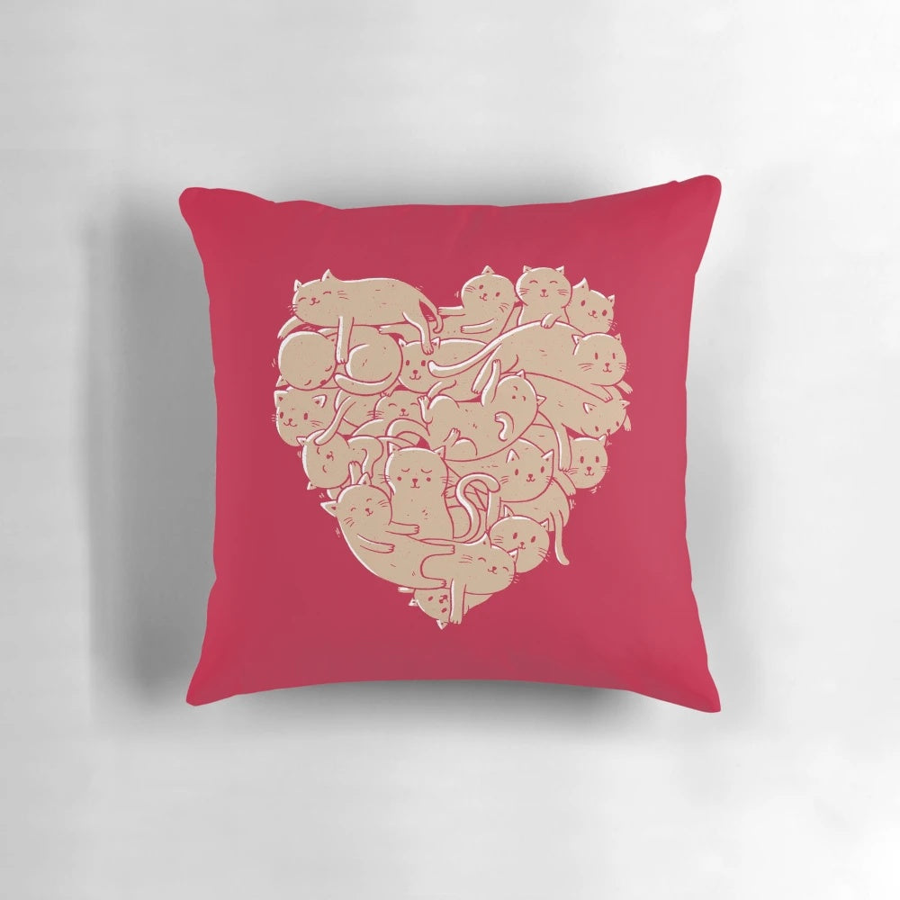 A heart-shaped pillow with a cat print, perfect for cat lovers and pet owners.