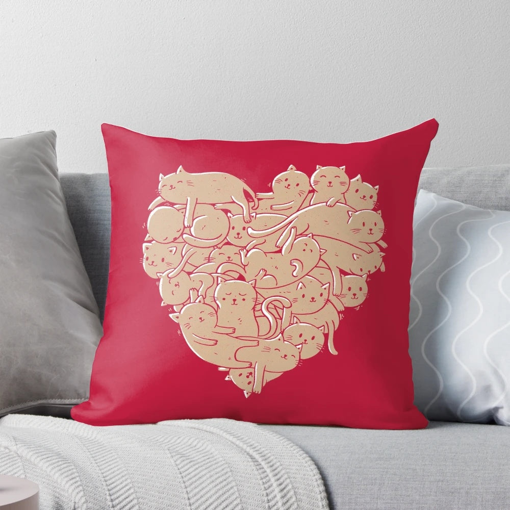 A heart-shaped pillow with a cat print, perfect for cat lovers and pet owners.