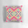 Decorative diamond-patterned accent pillow in pink and fuchsia colors
