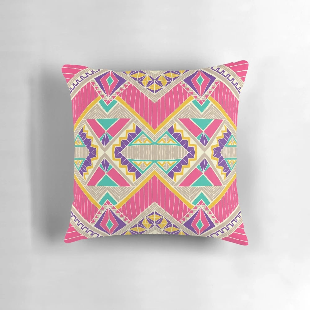 Decorative diamond-patterned accent pillow in pink and fuchsia colors