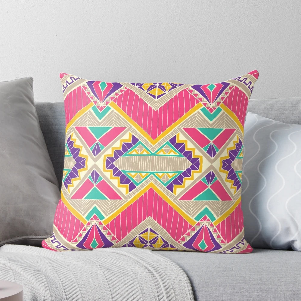 Decorative diamond-patterned accent pillow in pink and fuchsia colors