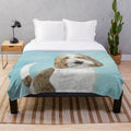 Grand Basset Griffon Vendeen dog portrait on a plush blanket