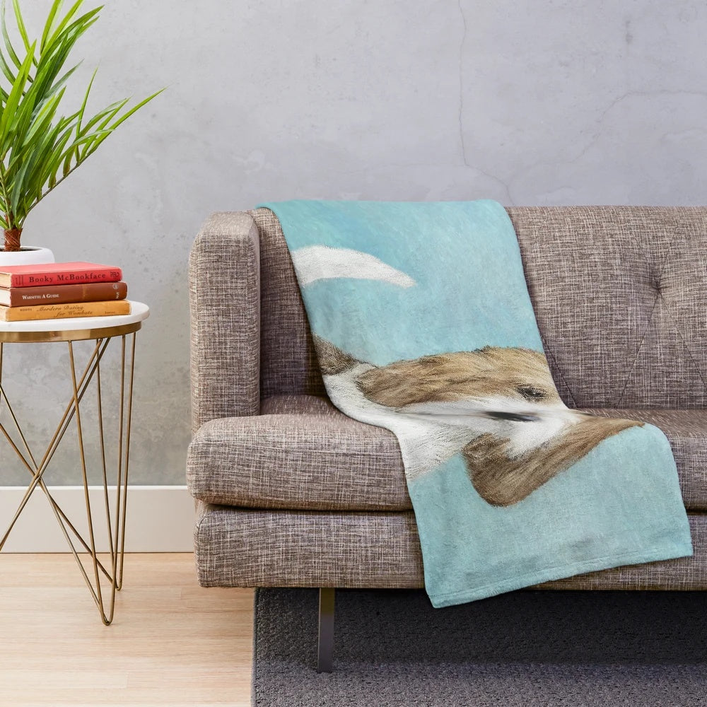 Grand Basset Griffon Vendeen dog portrait on a plush blanket