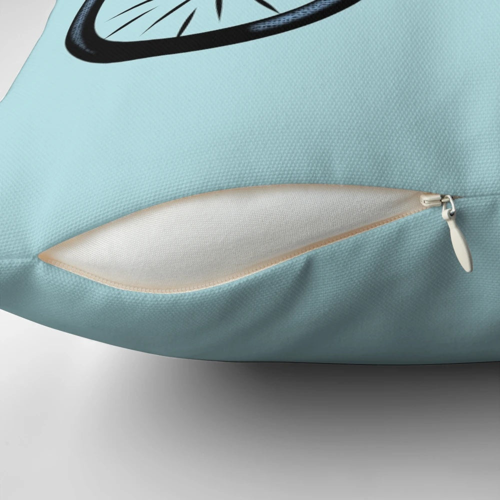 Honey badger riding a bicycle on a decorative throw pillow