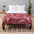 Meat-themed plush blanket with realistic texture and design