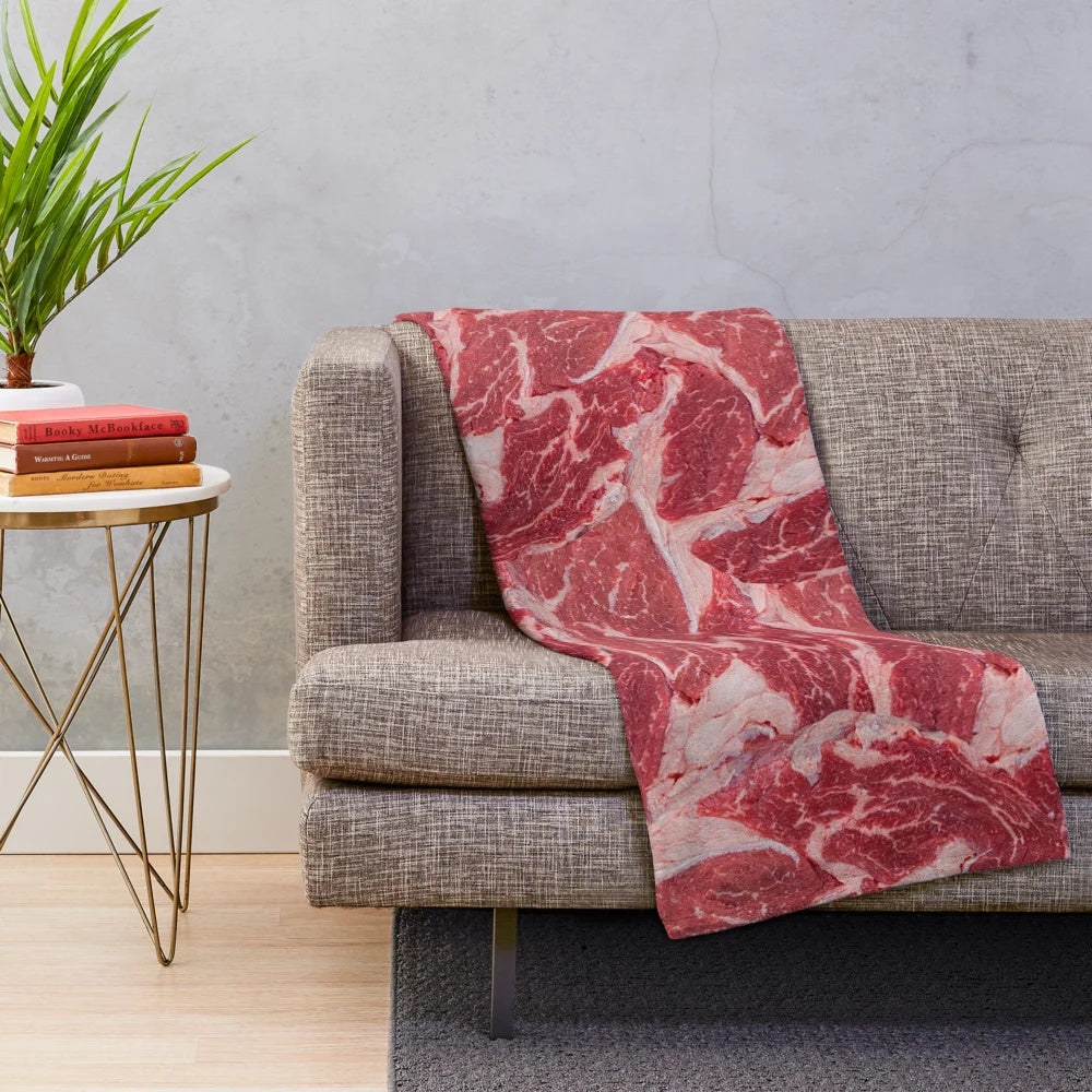 Meat-themed plush blanket with realistic texture and design