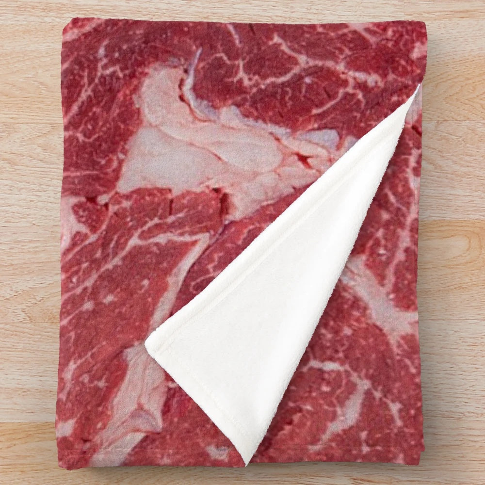 Meat-themed plush blanket with realistic texture and design