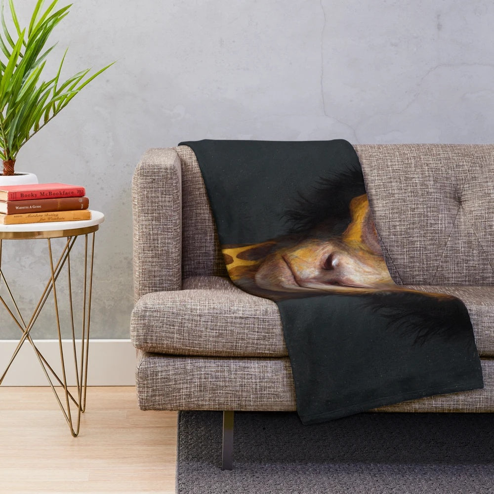 Whimsical plush blanket featuring a curious hybrid creature with a monkey body and giraffe neck