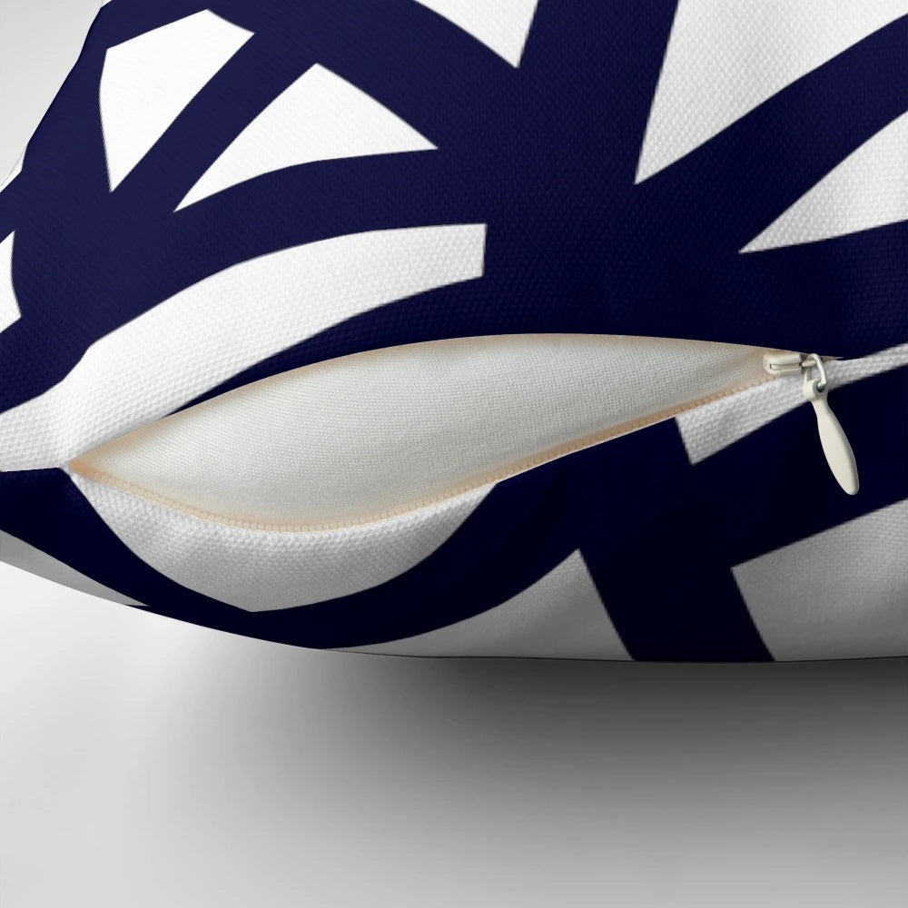 A navy blue decorative pillow with a geometric abstract pattern of intersecting lines and tiles
