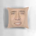 Decorative pillow featuring a fun and quirky Nicholas Cage face pattern design
