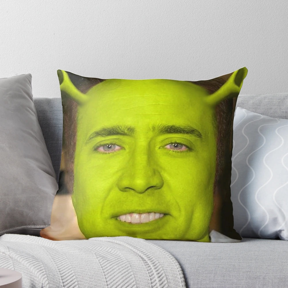 Pillow featuring the faces of Nicholas Cage and Shrek, a humorous pop culture meme design