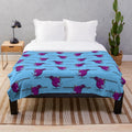 Colorful plush blanket featuring the iconic one-eyed one-horned flying purple people eater monster