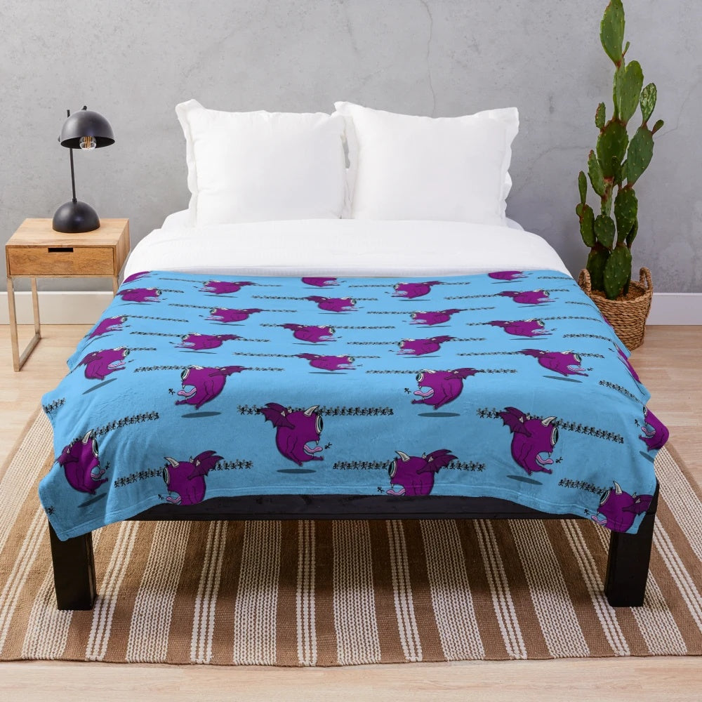 Colorful plush blanket featuring the iconic one-eyed one-horned flying purple people eater monster