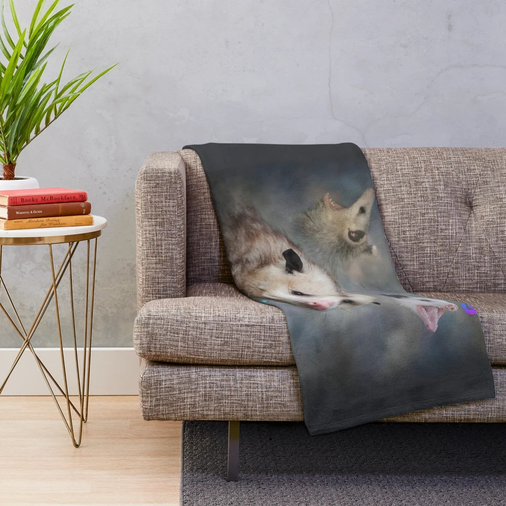 Opossum word art design on a plush blanket