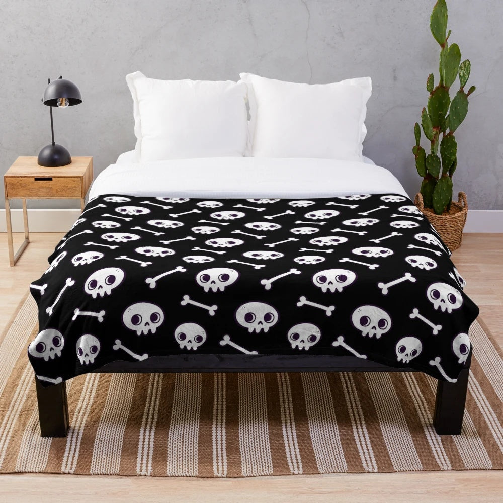 Plush blanket with a cute, spooky skull pattern