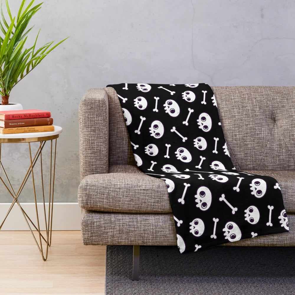 Plush blanket with a cute, spooky skull pattern