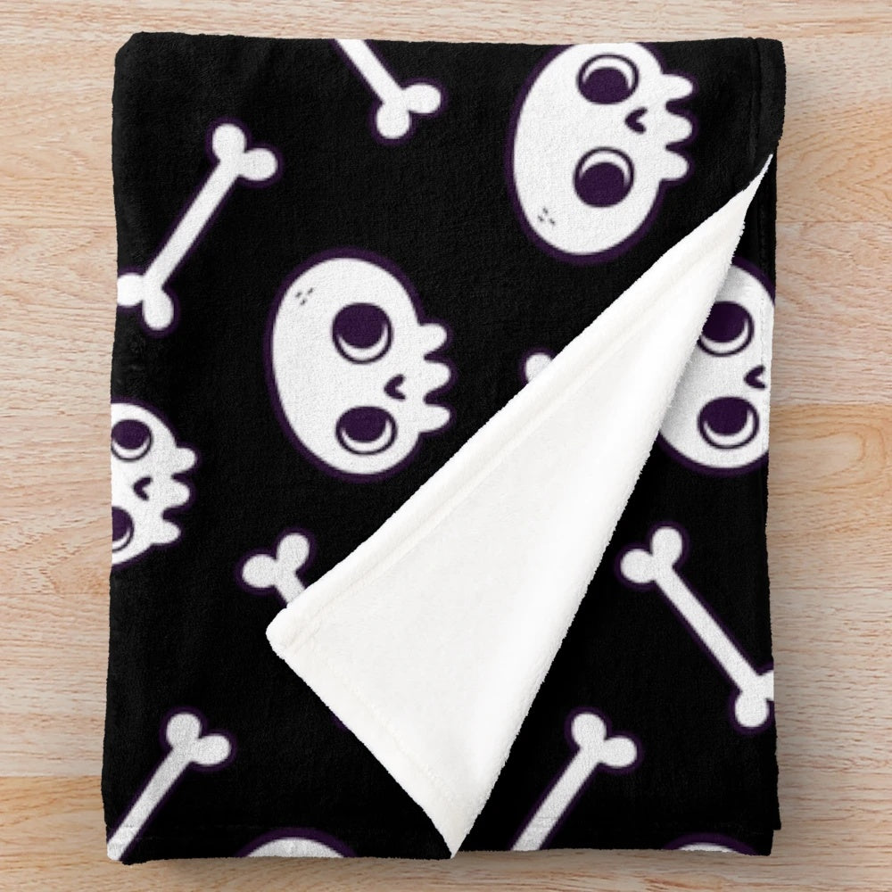 Plush blanket with a cute, spooky skull pattern