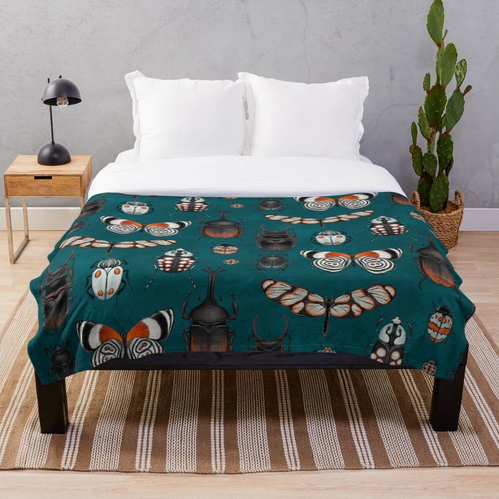 Plush blanket with detailed insect designs for nature and science lovers