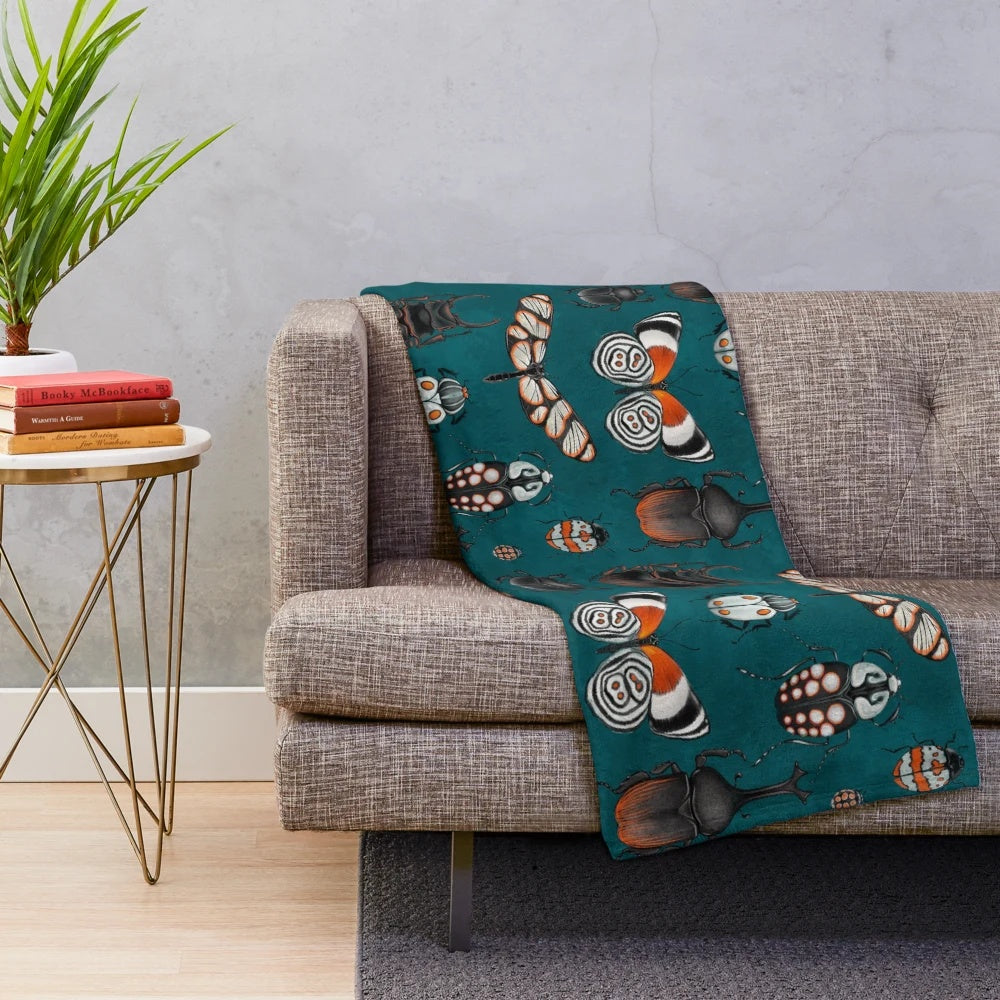 Plush blanket with detailed insect designs for nature and science lovers