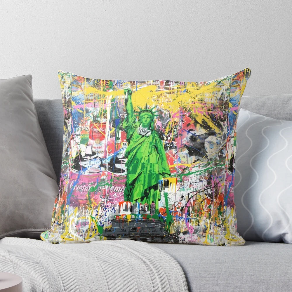 Vibrant pop culture-inspired pillow featuring a Banksy-style mashup of the Statue of Liberty holding a paintbrush.