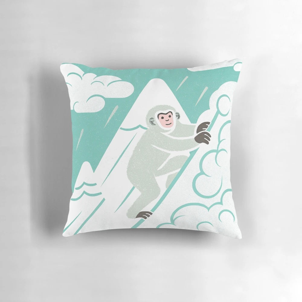 Vibrant pop art-inspired pillow featuring a snow monkey mountain climber design