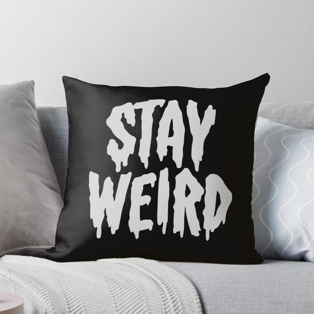 Cozy "Stay Weird" typography throw pillow for unique home decor