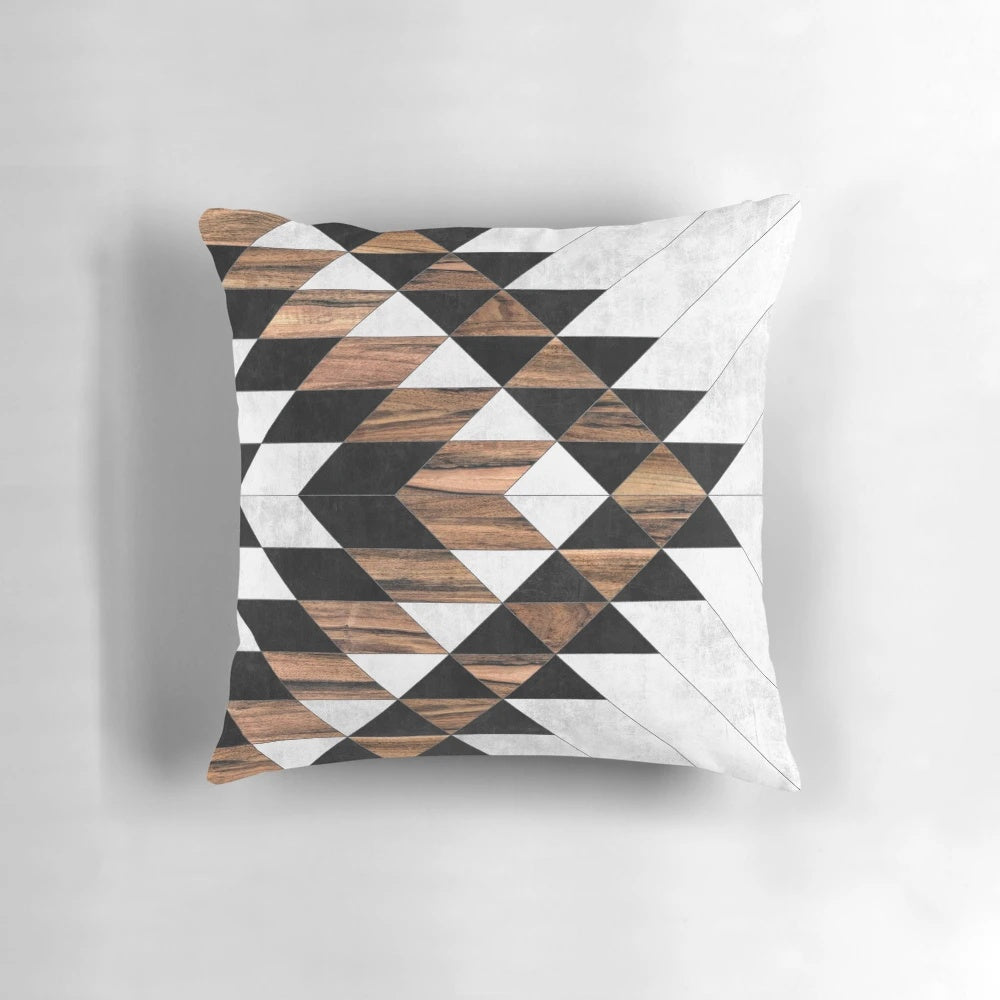 Decorative tribal patterned pillow with concrete and wood elements