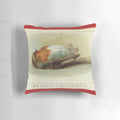 Unusual vintage-style pillow featuring a dead bird, perfect for adding a quirky touch to your holiday decor.