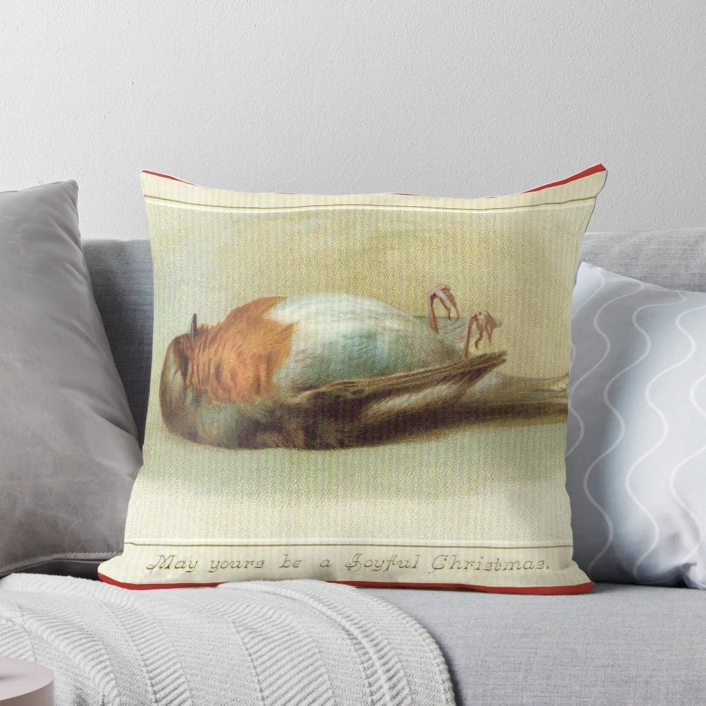 Unusual vintage-style pillow featuring a dead bird, perfect for adding a quirky touch to your holiday decor.