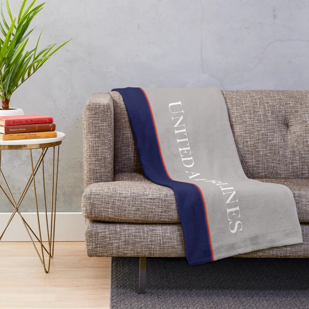 United Airlines-inspired battleship gray plush blanket with vintage airline logo