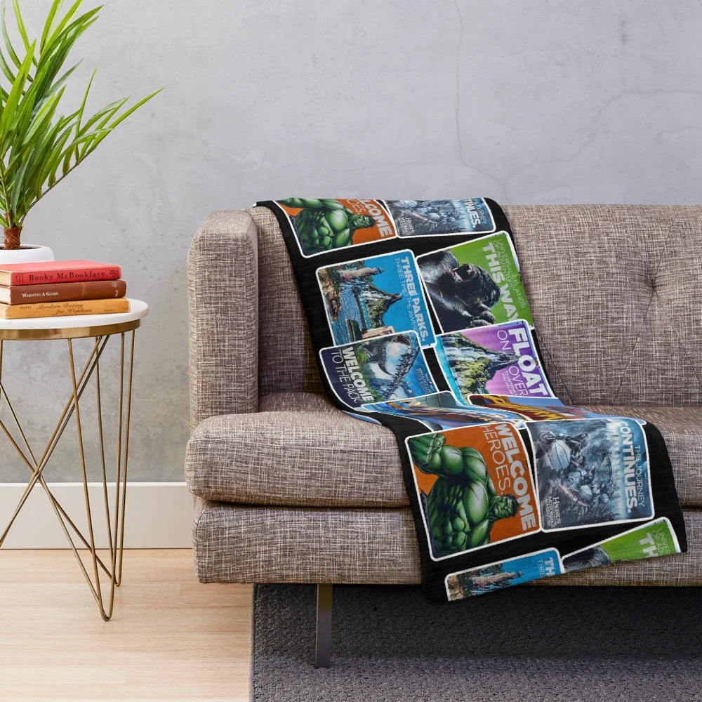 Universal Islands of Adventure-inspired plush blanket featuring a collage of iconic attractions