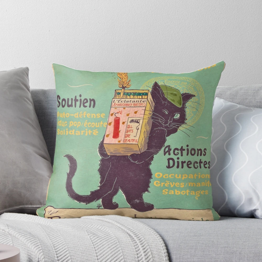 An art nouveau-style cat pillow with a revolutionary message of leftist and anarchist ideals.
